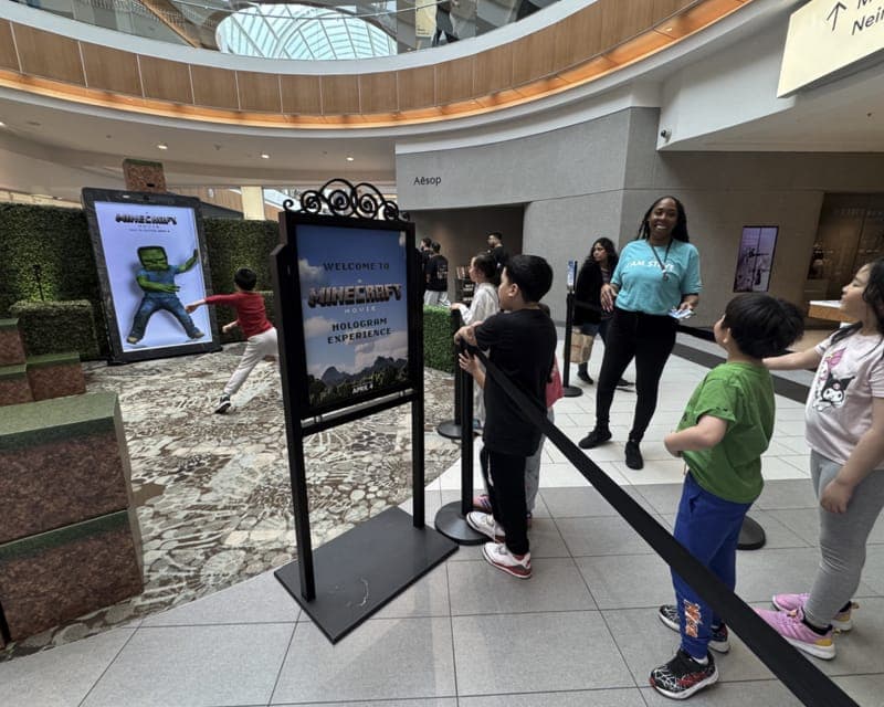 Shoppers line up for the A Minecraft Movie in-mall activation.